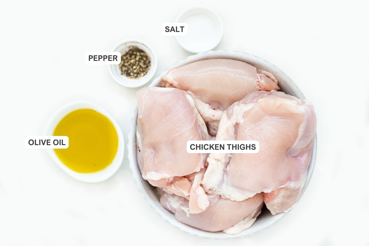 Ingredients for the recipe including chicken thighs, salt, pepper, and olive oil.