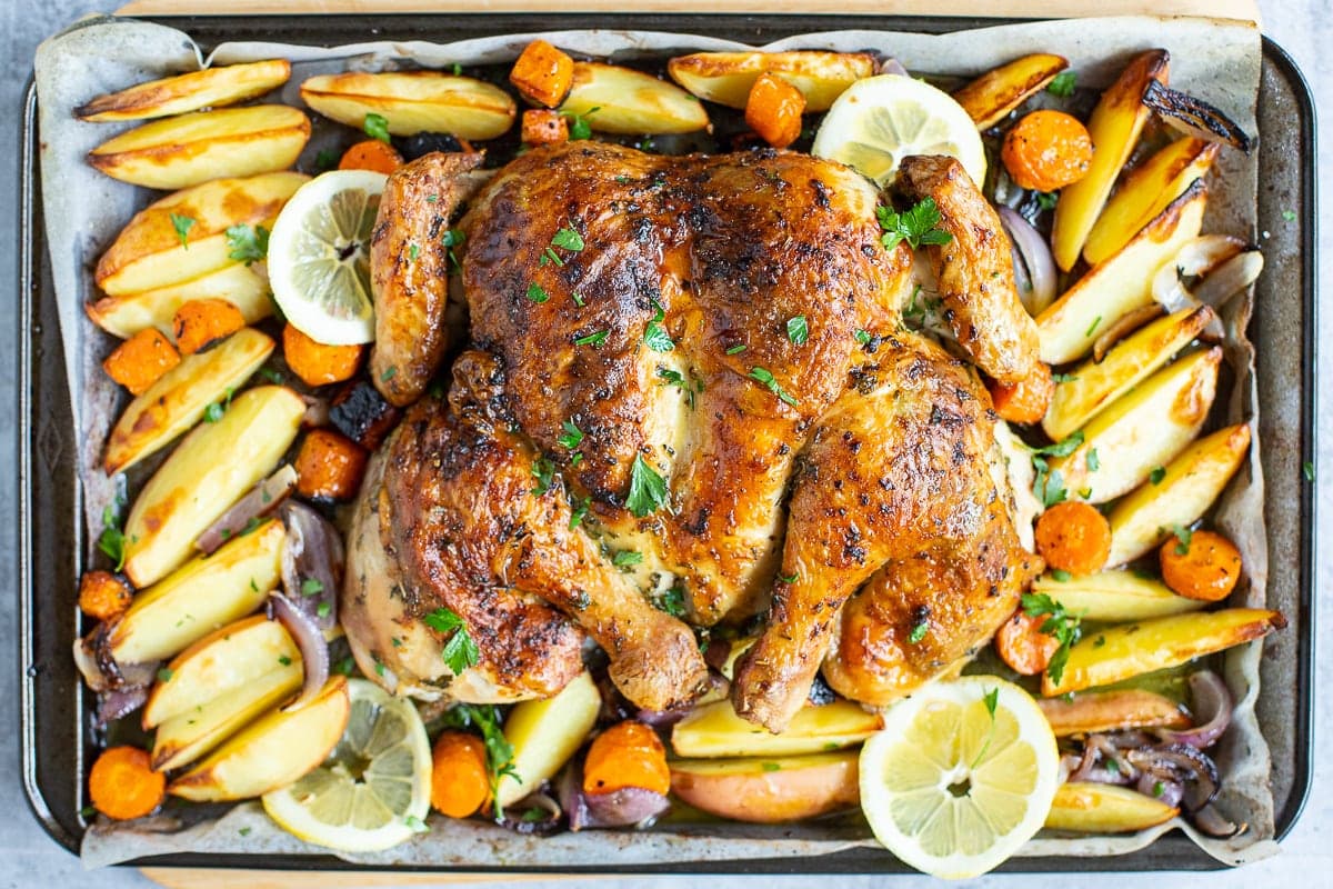 Roast Spatchcock chicken with herb garlic butter and vegetables.