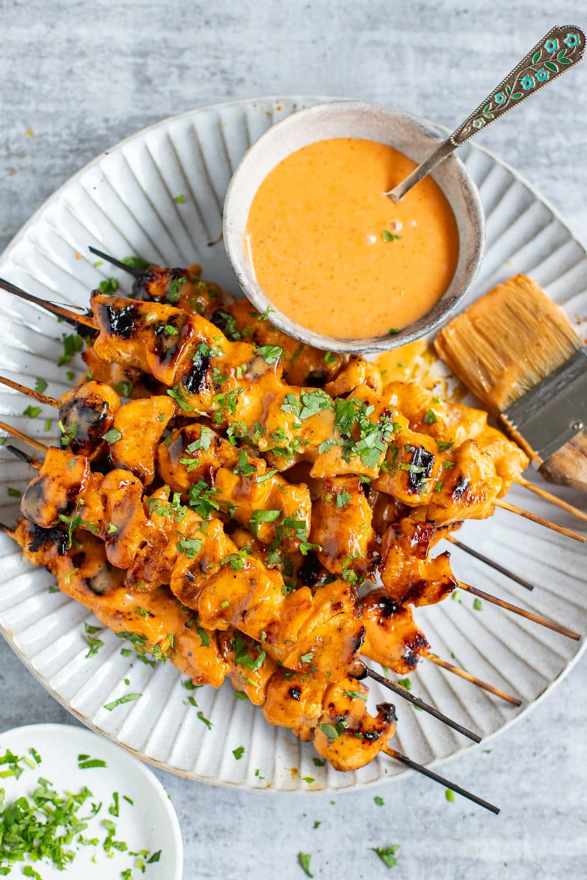 Chicken skewers with bang bang sauce.