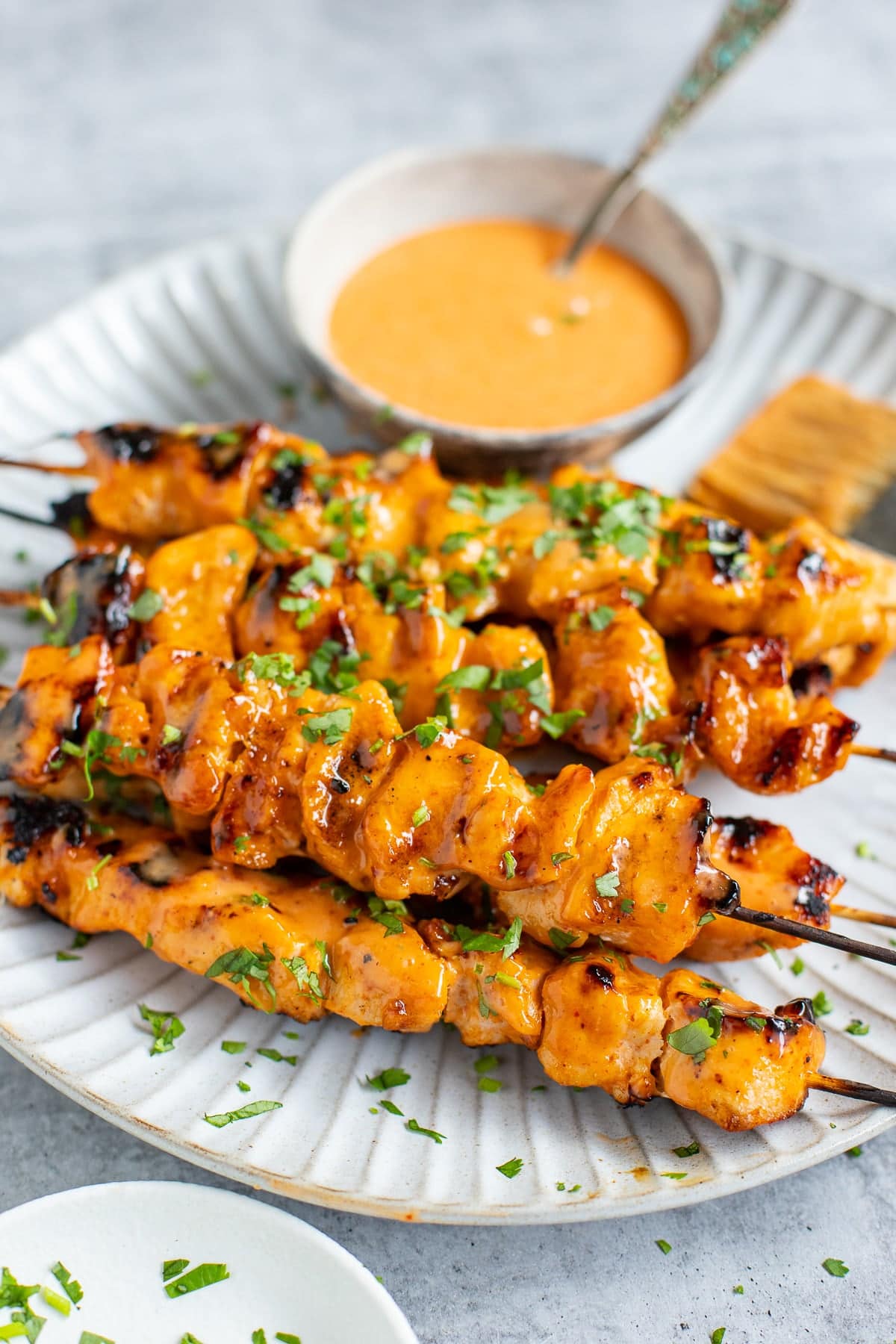 Chicken skewers with bang bang sauce.
