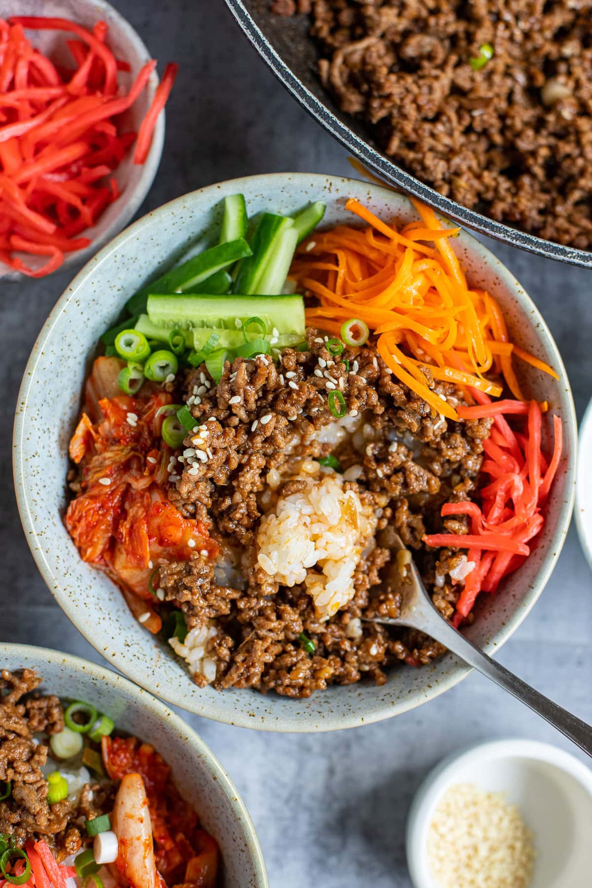 Ground beef bulgogi with rice, kimchi, and salad toppings.