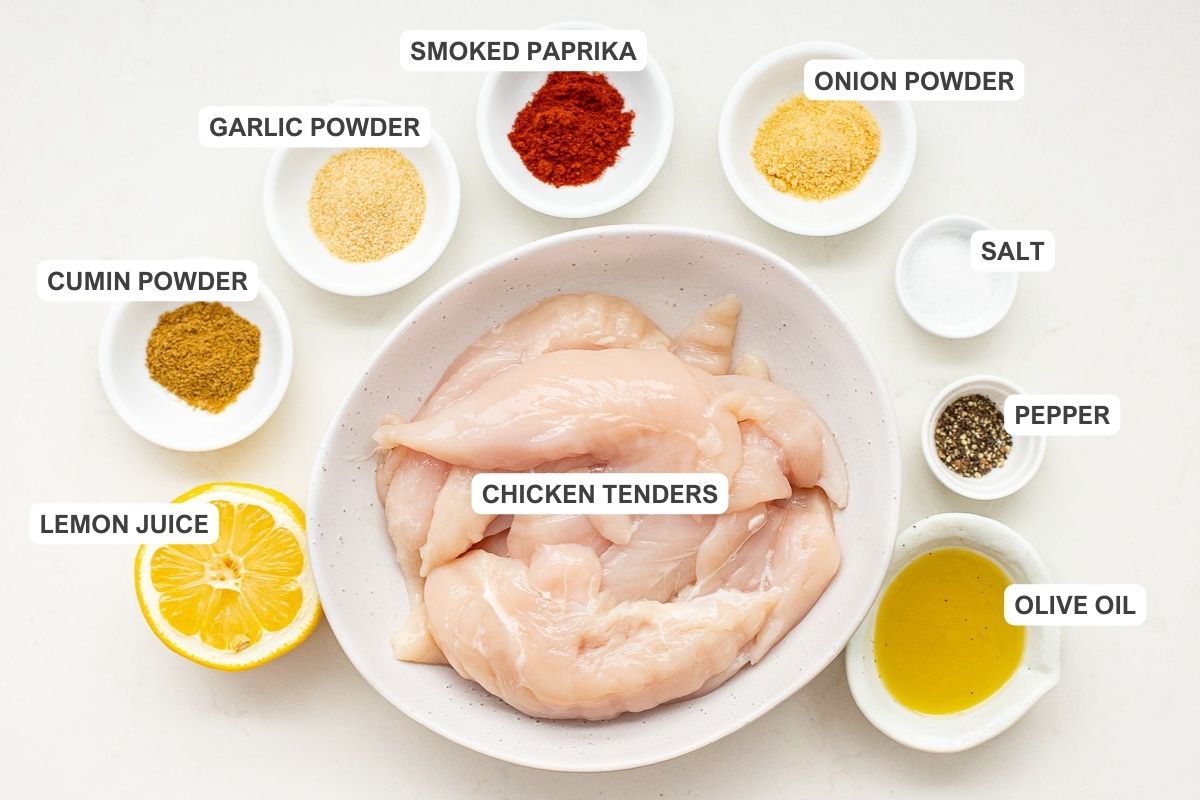 Ingredients for the recipe including chicken tenders, lemon juice, cumin powder, garlic powder, smoked paprika, onion powder, salt, pepper, and olive oil.