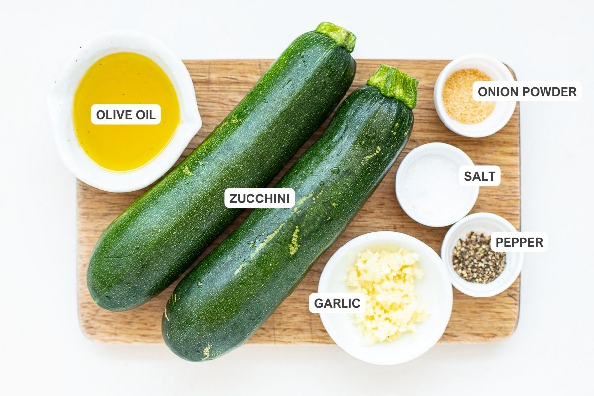 Ingredients for the recipe including zucchini, garlic, salt, pepper, onion powder, and olive oil.