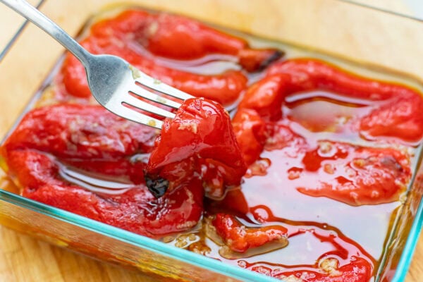 Roasted Red Peppers tossed in tangy garlic-infused olive oil