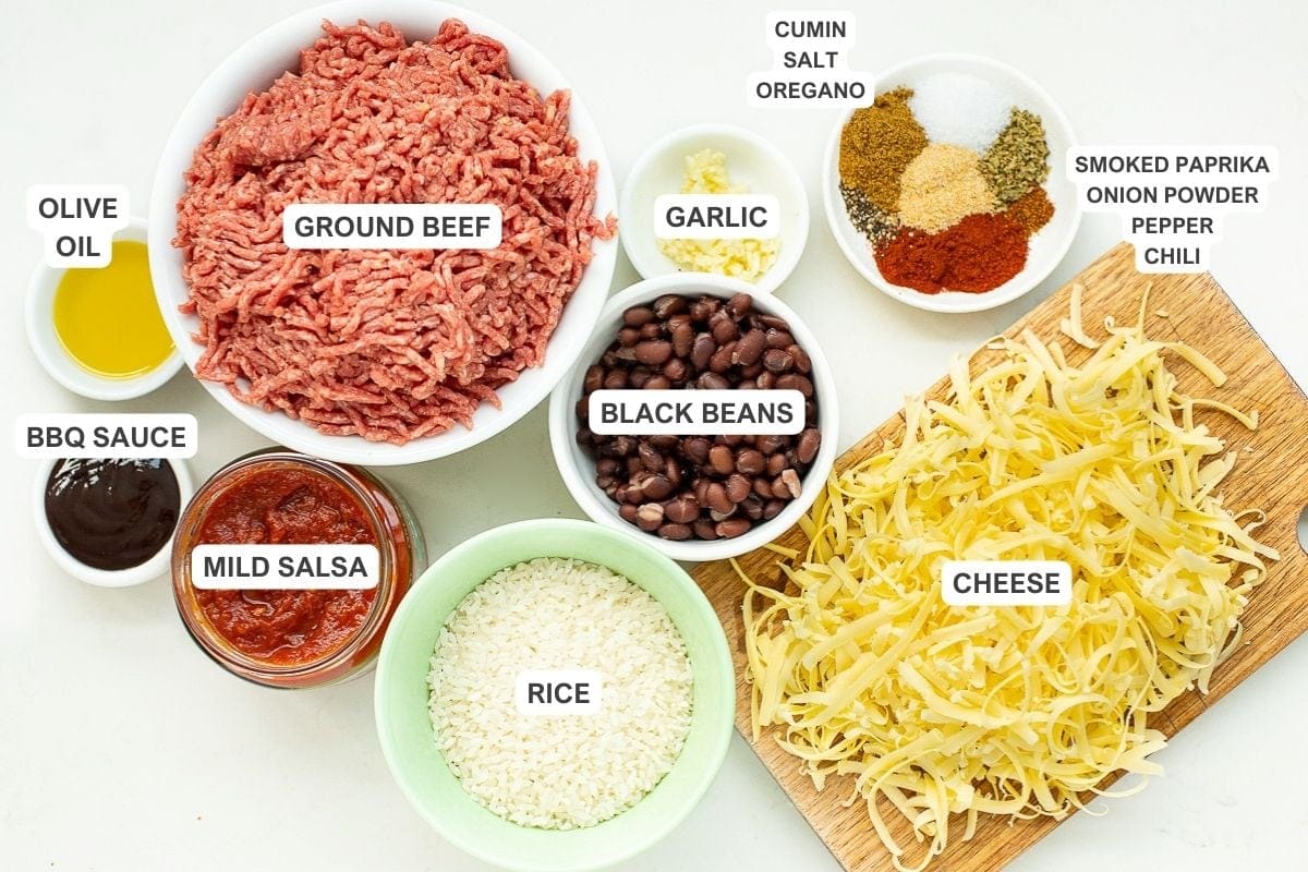 Ingredients for the recipe including ground beef, olive oil, bbq sauce, mild salsa, rice, black beans, garlic, cumin, salt, oregano, cheese, smoked paprika, onion powder, pepper, and chili.