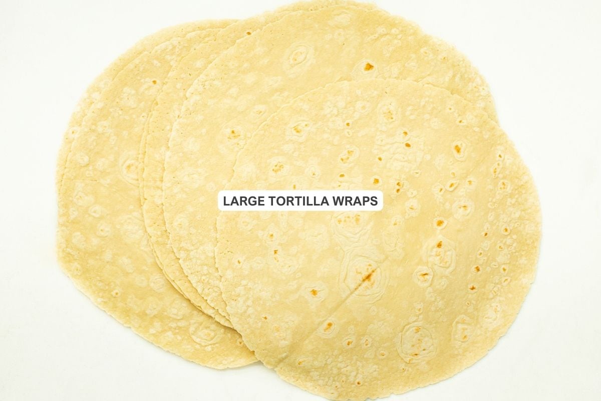 Ingredients for the recipe including large tortilla wraps.