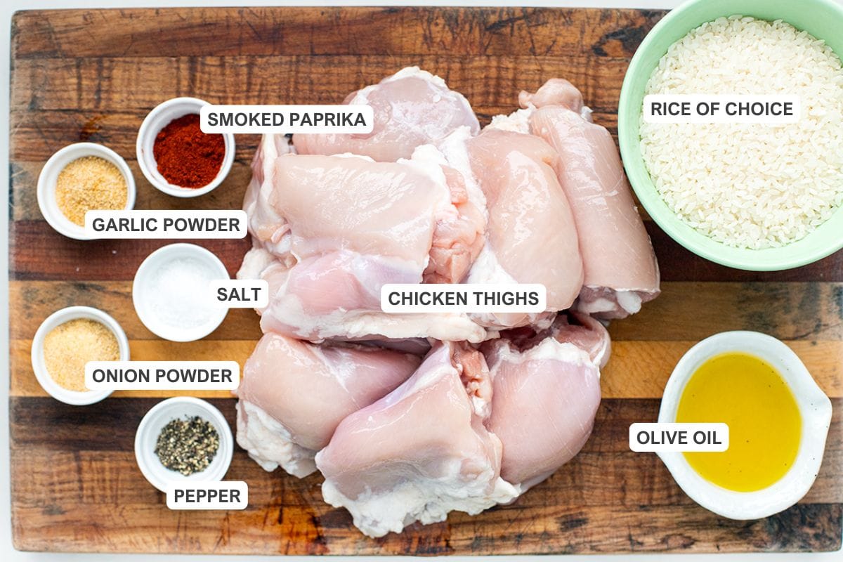Ingredients for the recipe including chicken thighs, rice of choice, olive oil, smoked paprika, garlic powder, salt, onion powder, and pepper.