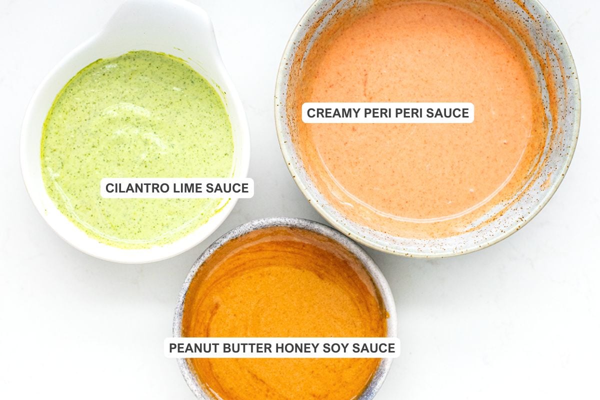 Three sauces for chicken & rice bowls: cilantro lime sauce, peanut butter honey soy sauce, and creamy peri peri sauce.