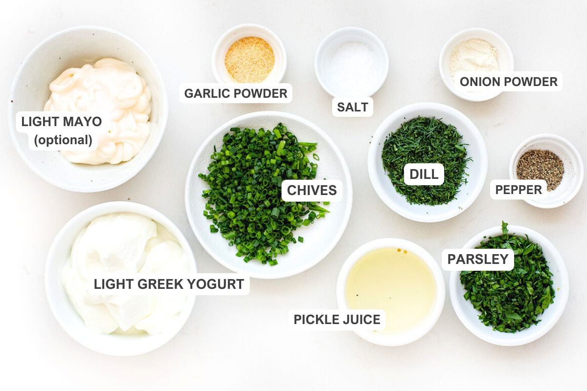 Ingredients for the recipe including light light Greek yogurt, chives, garlic powder, salt, dill, pickle juice, onion powder, pepper, parsley, and light mayo (optional)