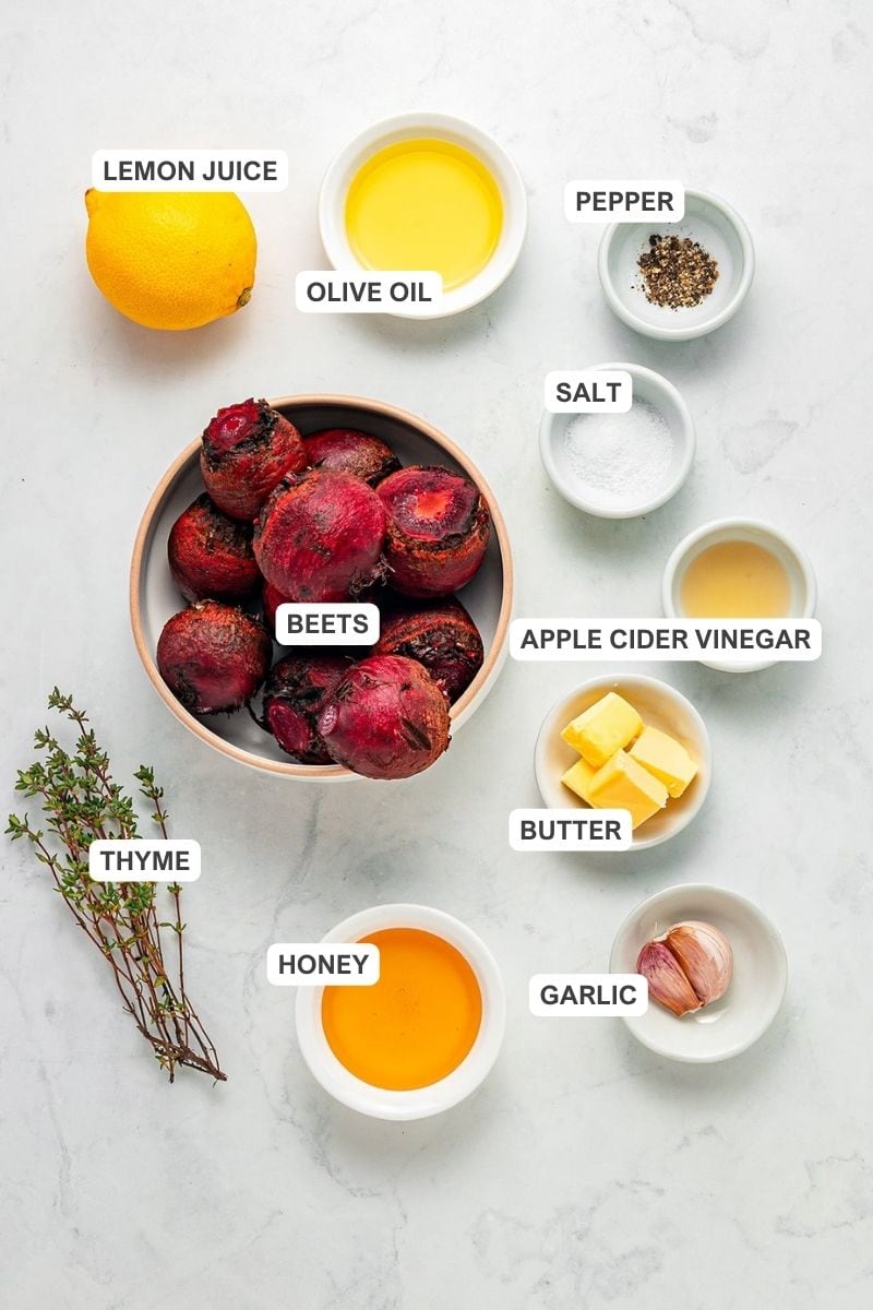 Ingredients for the recipe including beets, lemon juice, thyme, honey, butter, garlic, apple cider vinegar, salt, pepper, and olive oil.